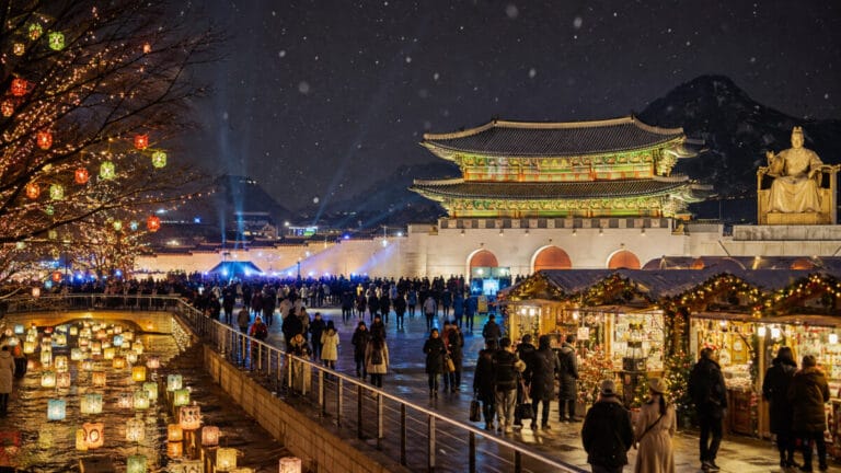 Seoul winter festivals at night near Gwanghwamun with snow, lanterns and Christmas market lights