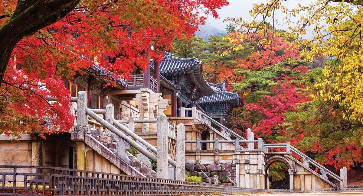 Bulguksa Temple in Gyeongju surrounded by red and orange autumn foliage