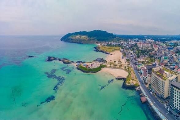 Aerial view of Jeju Island coastline and turquoise water