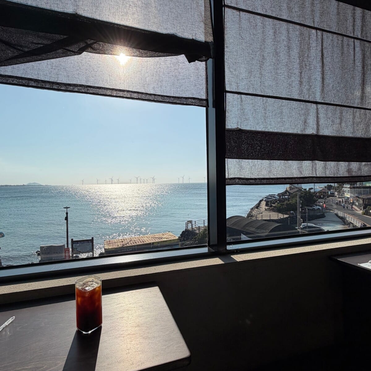 Sea view from a window seat at Cheongsudang Aewol cafe on Jeju Island