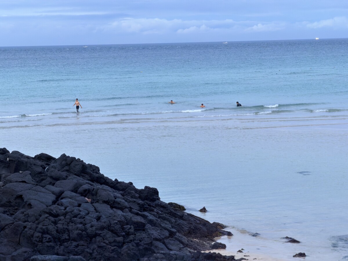 Calm coastal water at Hamdeok Beach in the evening