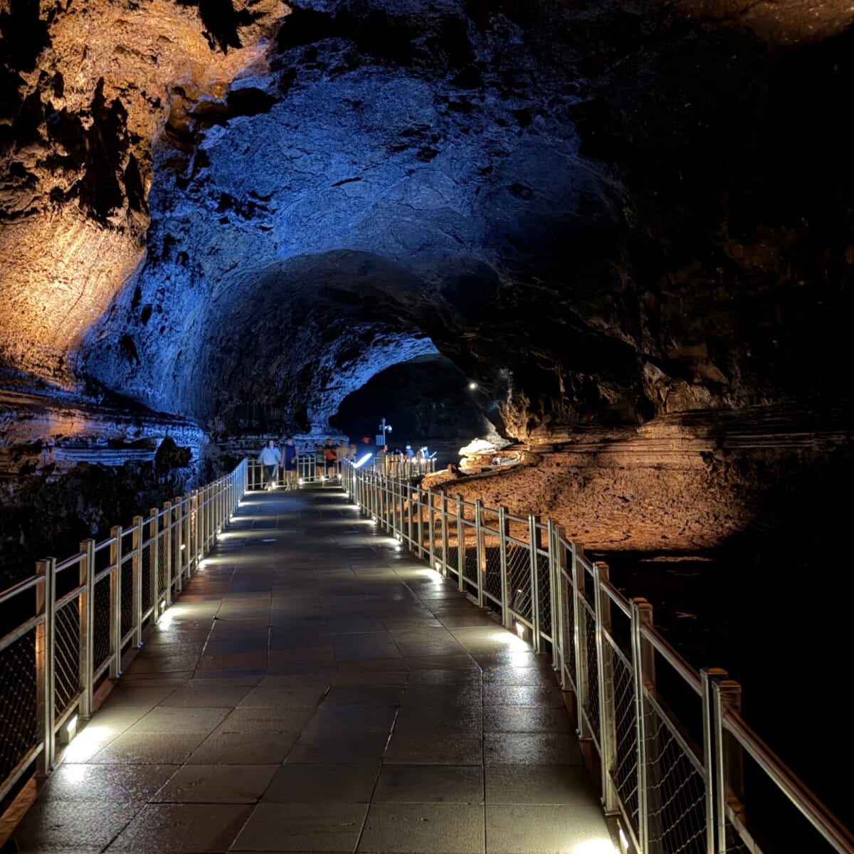 Lit visitor walkway inside Manjanggul Lava Tube