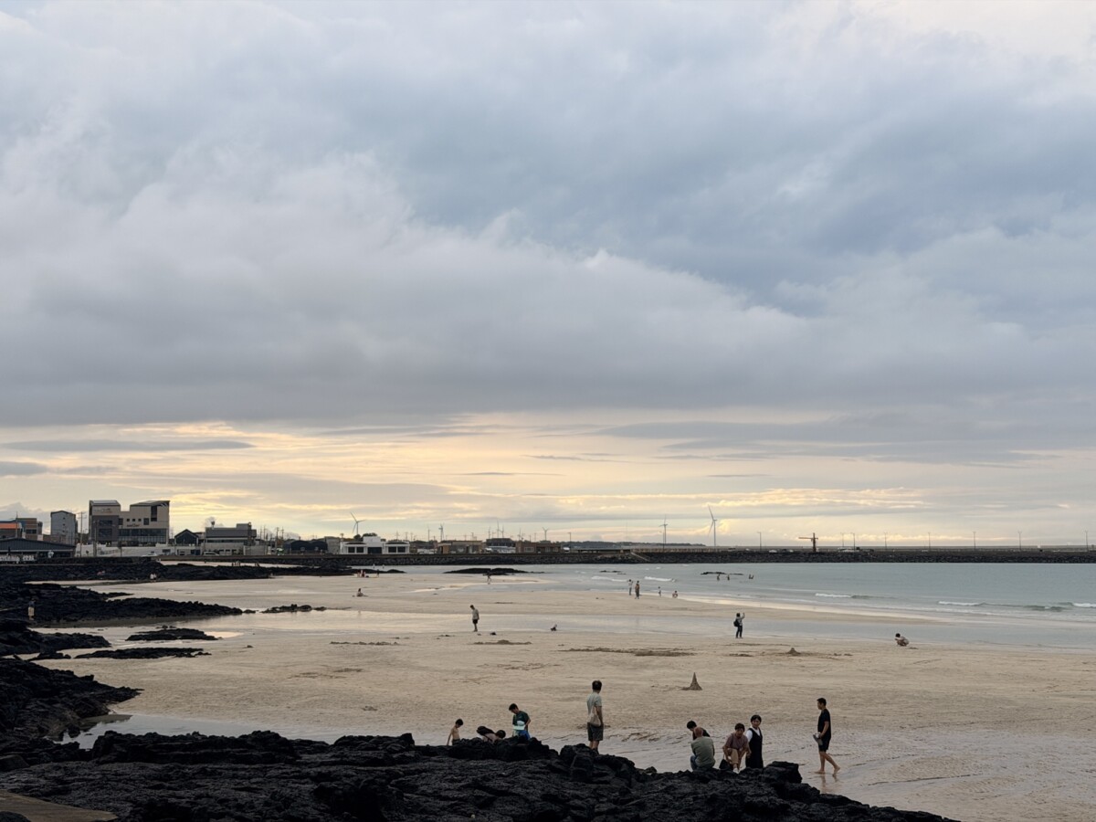 Wide late-afternoon view of Sehwa Beach in Jeju