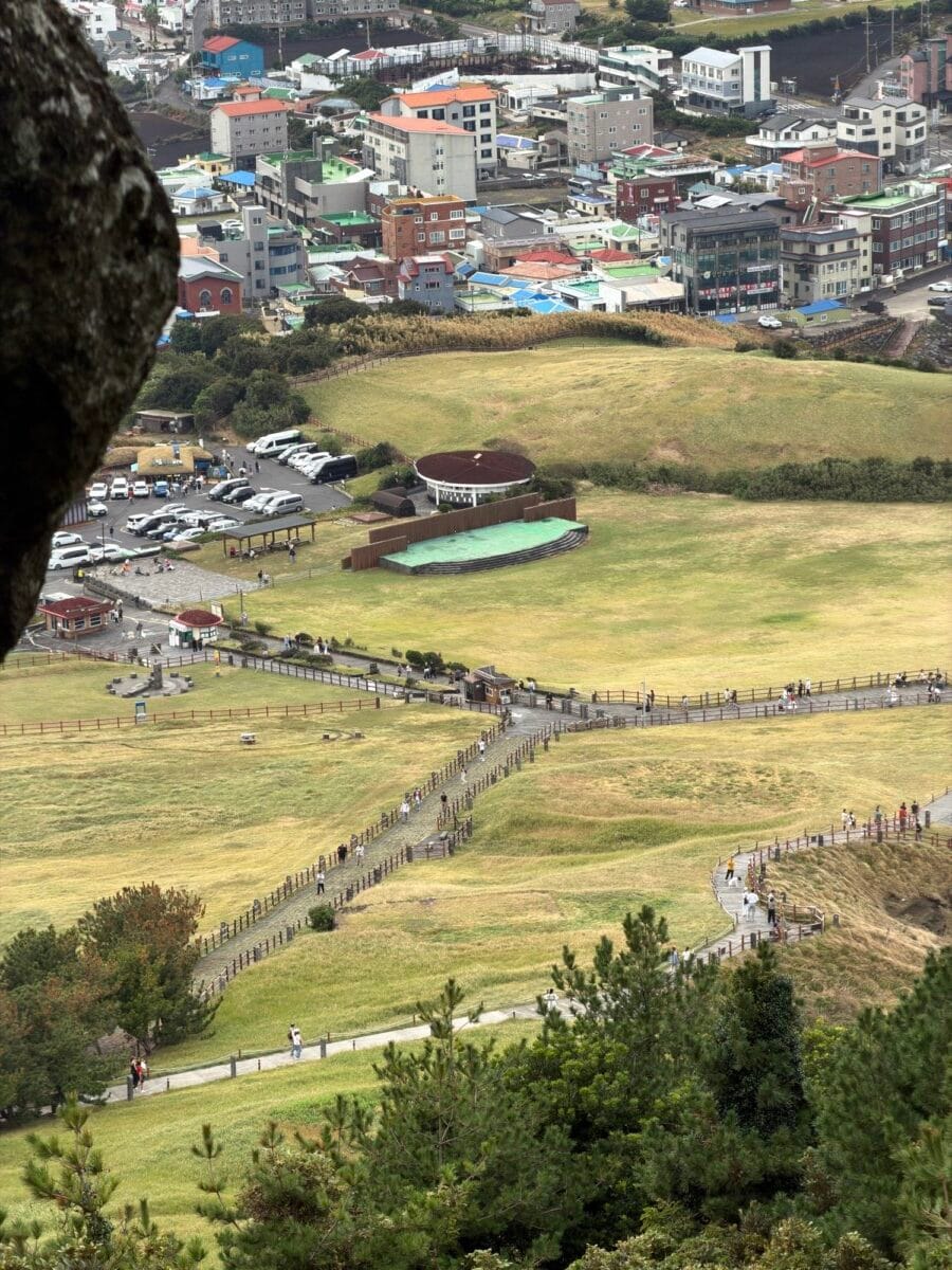 Seongsan Ilchulbong trail and fields seen from higher on the climb